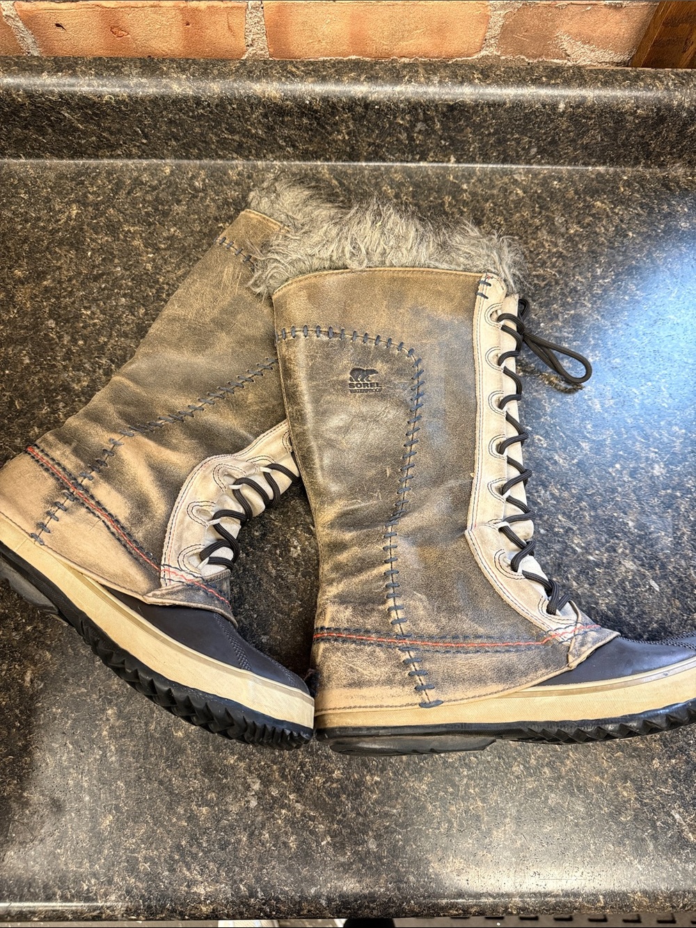 Sorel Women's Tall Lace-Up Winter Boots in Brown and Black with Faux Fur Trim